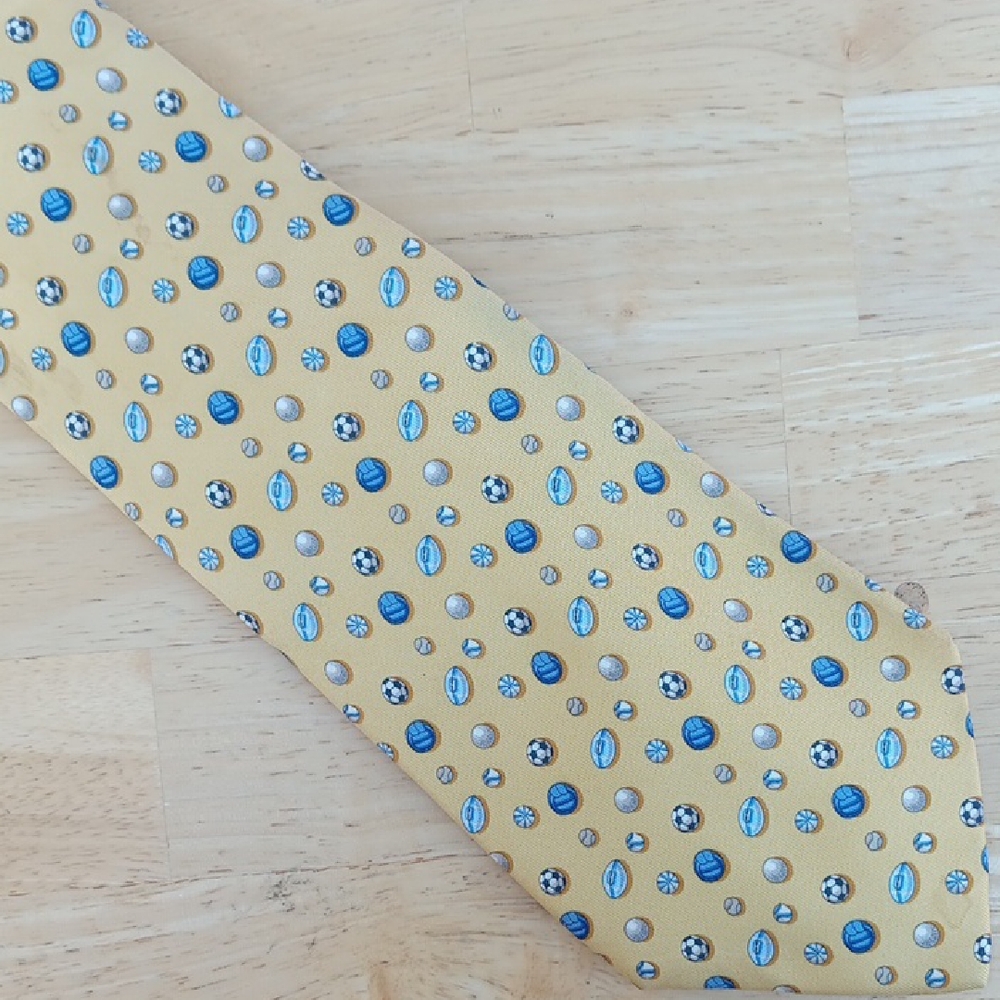 Salvatore Ferragamo Gold Tie with Blue and White Sports Pattern